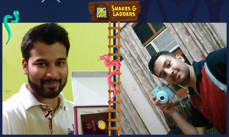 Flipkart customers Abdul Jaleel (L) and Mantavya Goyal (R) pose with the prizes they won in the Snakes & Ladders game